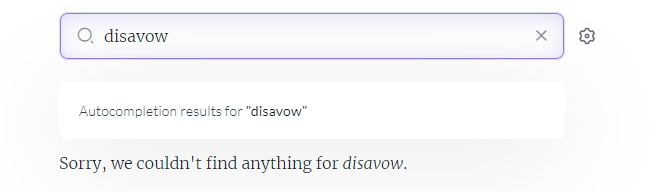 The image shows a search interface with a query for "disavow" entered in the search bar. Below the search bar, the following message is displayed: Autocompletion results for "disavow" Sorry, we couldn't find anything for disavow. The search bar is highlighted with a purple border, and there is a settings icon next to it on the right. The message indicates that there were no autocompletion results or search results found for the term "disavow."
